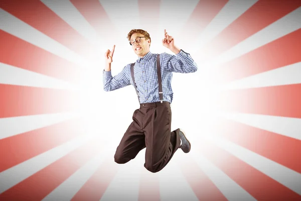 Geeky hipster jumping and pointing — Stock Photo, Image