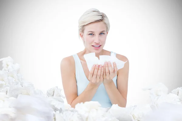 Sick woman holding tissues — Stock Photo, Image