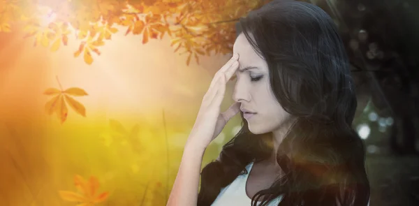 Pretty brunette getting a headache — Stock Photo, Image