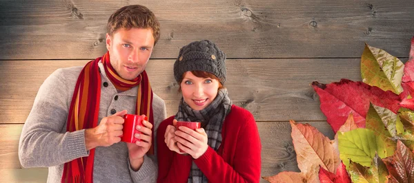 Couple both having warm drinks — Stock Photo, Image