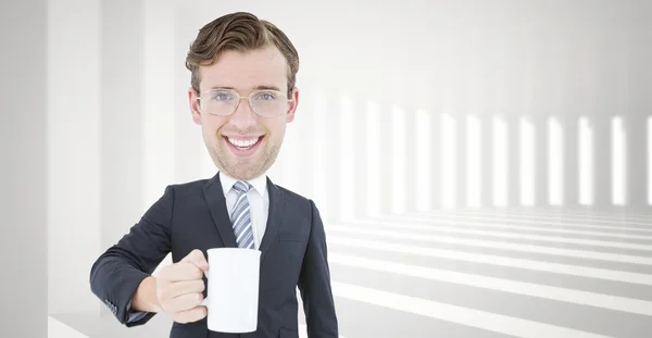 Geeky businessman holding mug — Stock Photo, Image