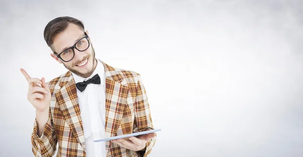 Geeky hipster holding a tablet pc — Stock Photo, Image