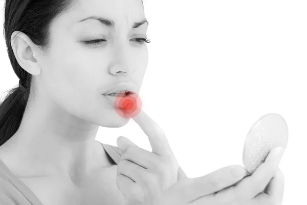 Worried woman looking at her lips — Stock Photo, Image