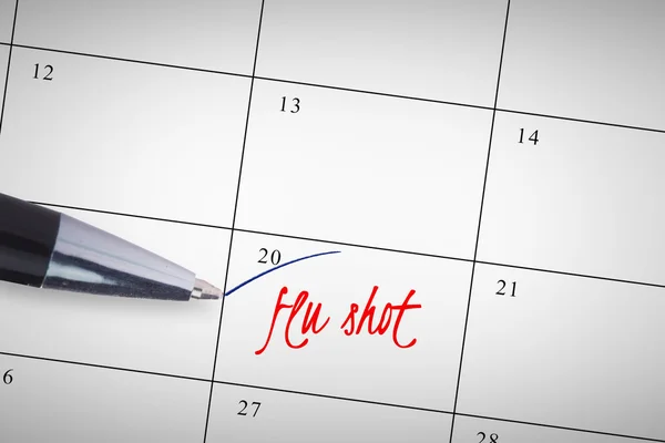 Pluma contra la gripe vacuna en el calendario —  Fotos de Stock