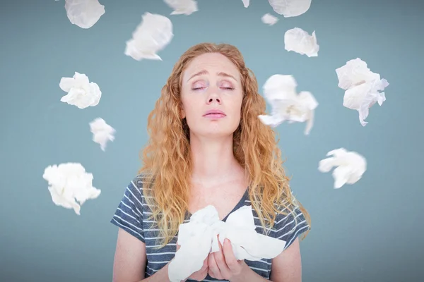 Sick blonde woman holding paper tissue — Stock Photo, Image