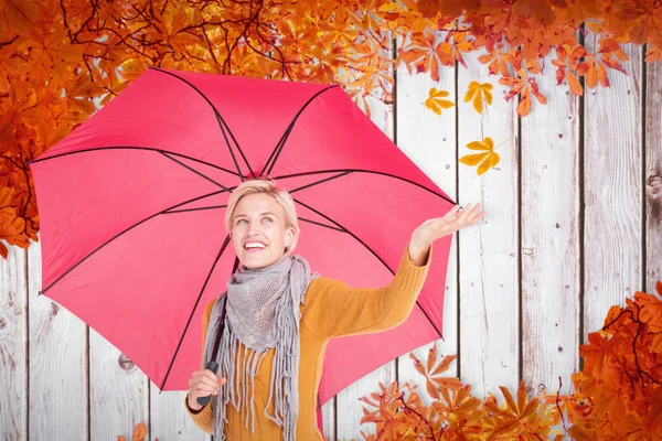 Woman checking to see if its raining — Stock Photo, Image