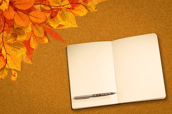 Composite image of notebook and pen — Stock Photo, Image