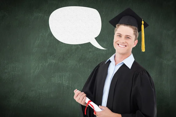 Smiling man with a degree in hand as he looks — Stock Photo, Image