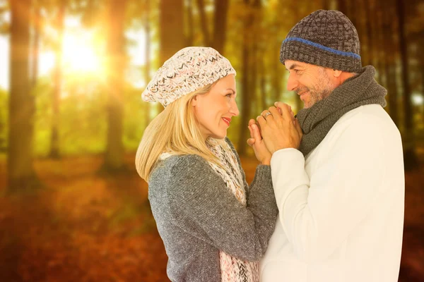 Cute smiling couple holding hands — Stock Photo, Image