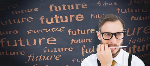 Geeky hipster biting on pencil — Stock Photo, Image