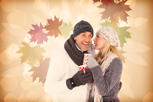 Happy couple gossiping while drinking hot tea — Stock Photo, Image