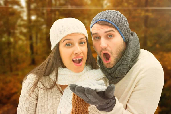 Composite image of young winter couple — Stock Photo, Image