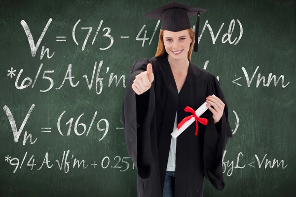 Teenage girl celebrating graduation with thumbs — Stock Photo, Image