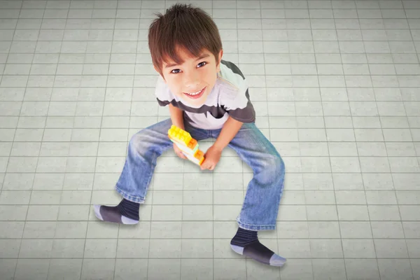 Cute boy sitting with building blocks — Stock Photo, Image