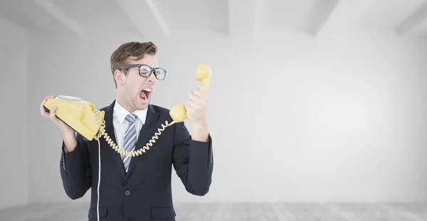 Businessman shouting at telephone — Stock Photo, Image