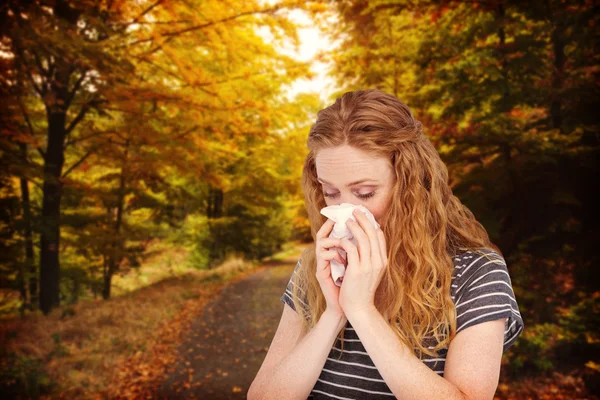 Sick blonde woman blowing her nose — Stock Photo, Image