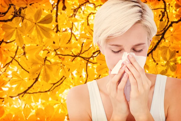 Sick woman blowing her nose — Stock Photo, Image