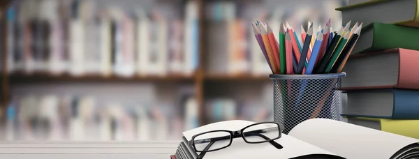 Composite image of school supplies on desk — Stock Photo, Image