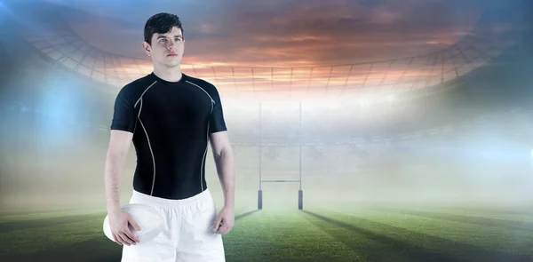 Rugby player holding a rugby ball — Stock Photo, Image