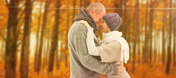 Mature couple in winter clothes embracing — Stock Photo, Image