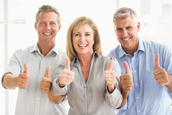 Business people doing thumbs up — Stock Photo, Image