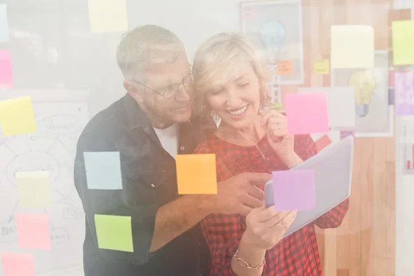 Business team looking at a digital tablet — Stock Photo, Image