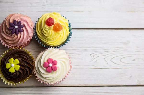 Delicious cupcakes on a table — Stock Photo, Image