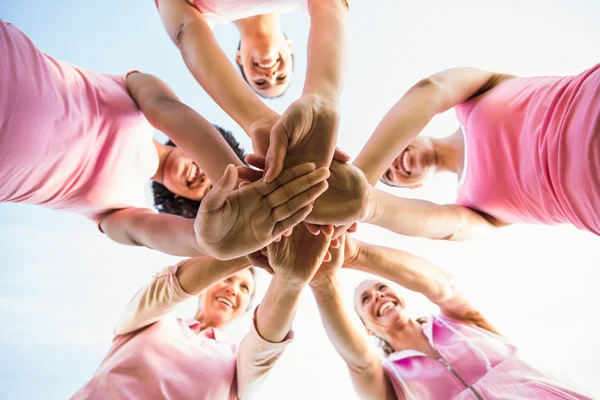 Women putting hands together — Stock Photo, Image