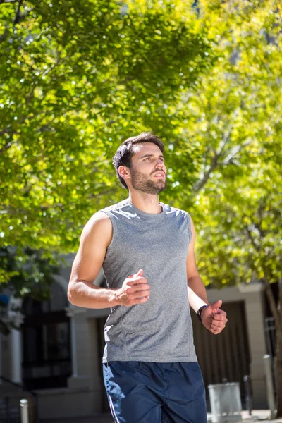 Handsome athlete running — Stock Photo, Image