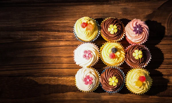 Delicious cupcakes on a table — Stock Photo, Image