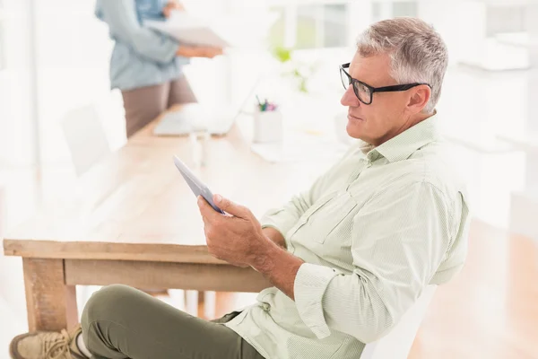 Attentive businessman working on a tablet — Stock Photo, Image