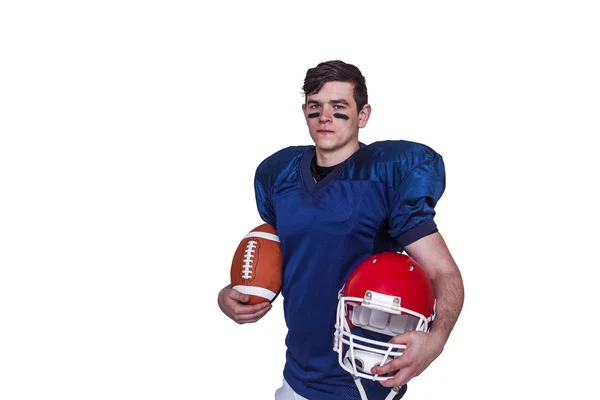 Player holding a ball and helmet — Stock Photo, Image