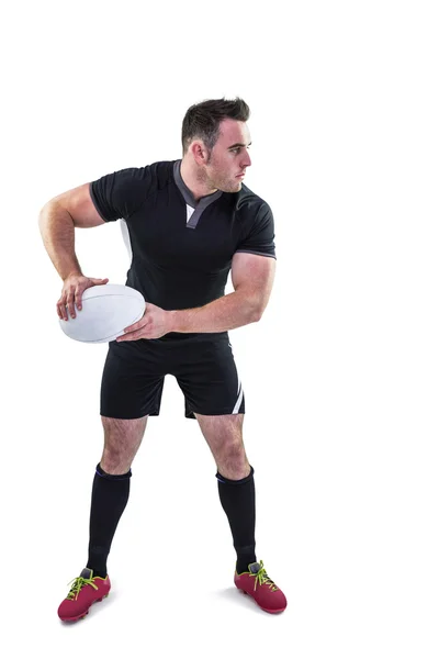 Joueur de rugby lançant la balle — Photo