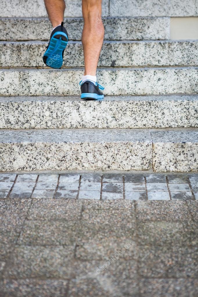 Athlete jogging up the stairs Stock Photo by ©Wavebreakmedia 84459952
