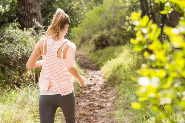 Blonda idrottsman jogging — Stockfoto