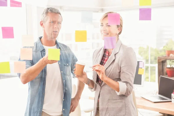 Casual business colleagues working with sticky notes — Stock Photo, Image