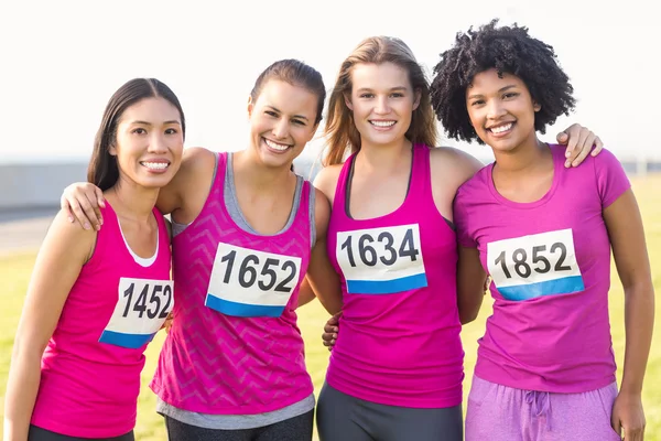Four smiling runners — Stock Photo, Image