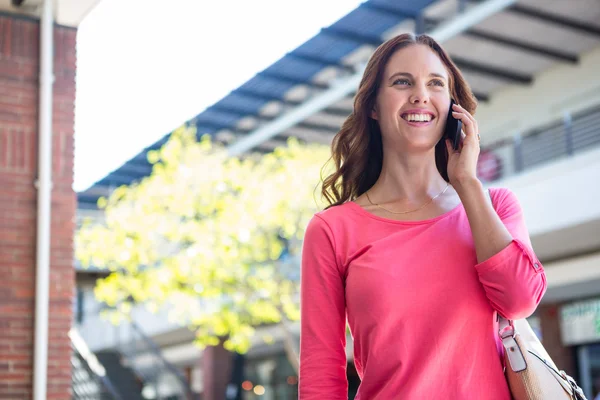 Pretty woman on the phone at the mall — Stock Photo, Image