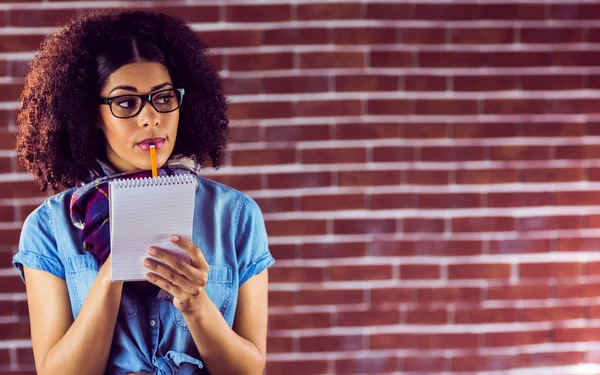 Attractive hipster taking notes — Stock Photo, Image