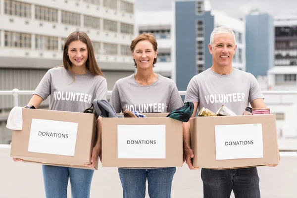 Volunteers holding donation boxes — Stock Photo, Image