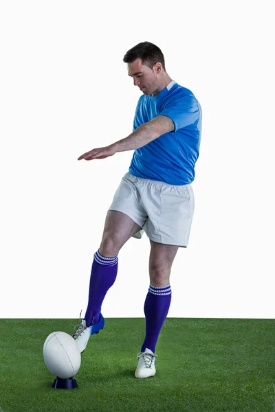 Rugby player doing a drop kick — Stock Photo, Image