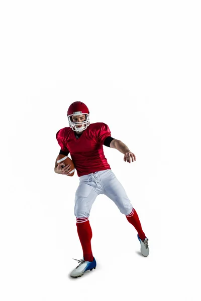 Football player protecting football — Stock Photo, Image