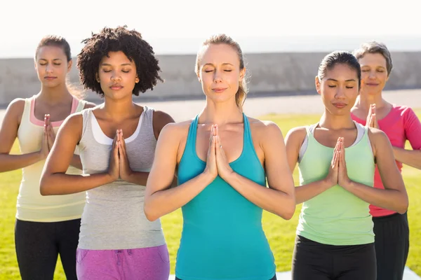 Women doing prayer position — Stock Photo, Image