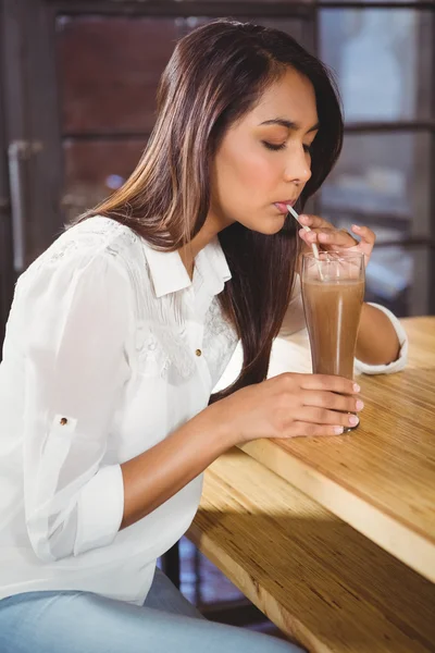 Woman drinking a hot chocolate — Stock Photo, Image