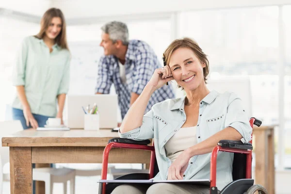 Casual businesswoman in wheelchair — Stock Photo, Image