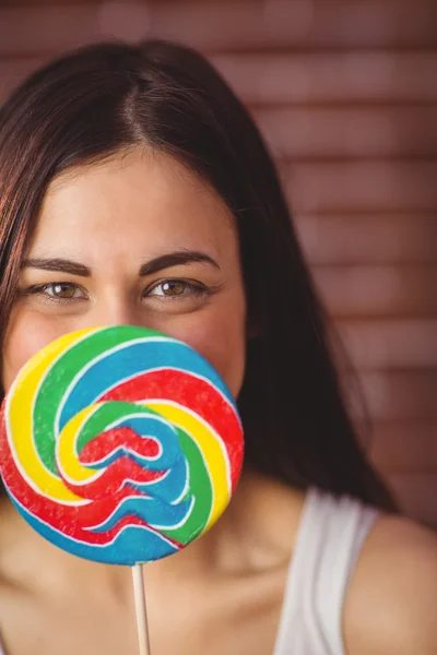 Pretty hipster with lollipop — Stock Photo, Image