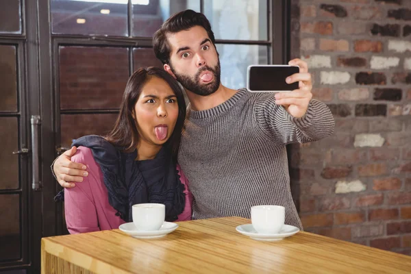 Grimacing friends taking selfie — Stock Photo, Image