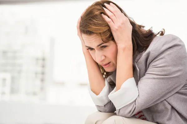 Worried casual businesswoman — Stock Photo, Image