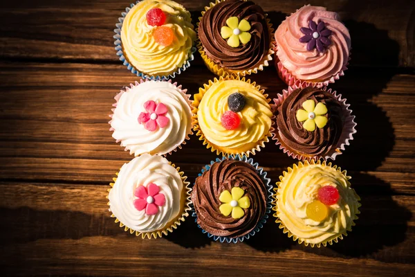 Delicious cupcakes on a table — Stock Photo, Image