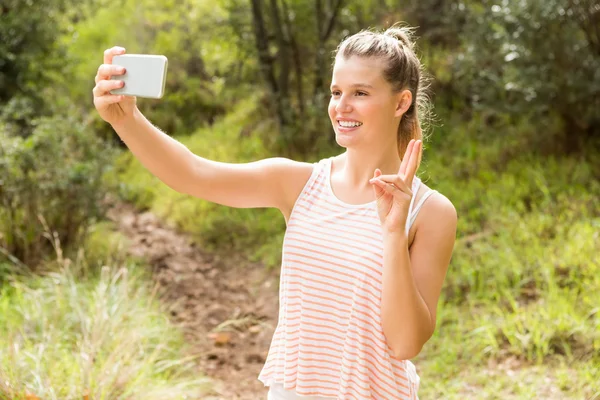 Blonde showing peace sign — Stock Photo, Image